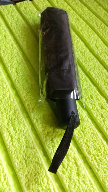 Wukusy 2-fold manual umbrella with steel shaft, windproof and rainproof, featuring wrist straps for easy holding for women, men, and kids.