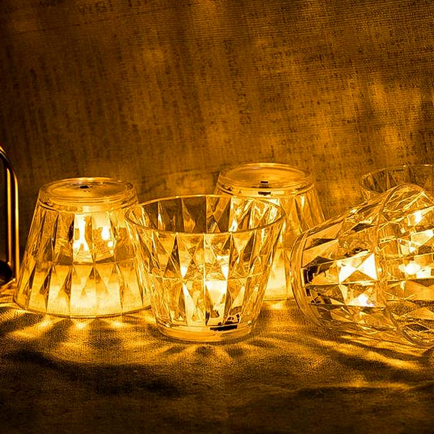 Wukusy cup-shaped crystal table lamp with a sleek home decor design, featuring a transparent glass body and soft lighting.