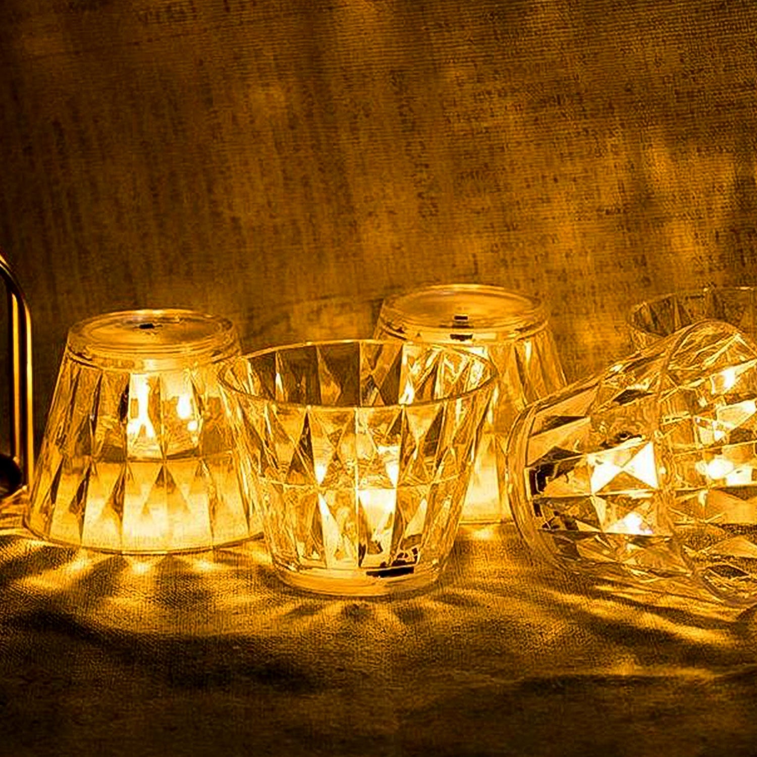 Wukusy cup-shaped crystal table lamp with a sleek home decor design, featuring a transparent glass body and soft lighting.