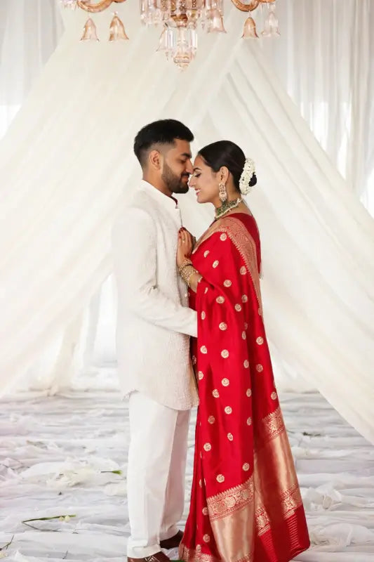 Elegant red Banarasi silk saree for women from Ekom's Royal Red Banarasi Elegance Collection, featuring intricate gold zari work.