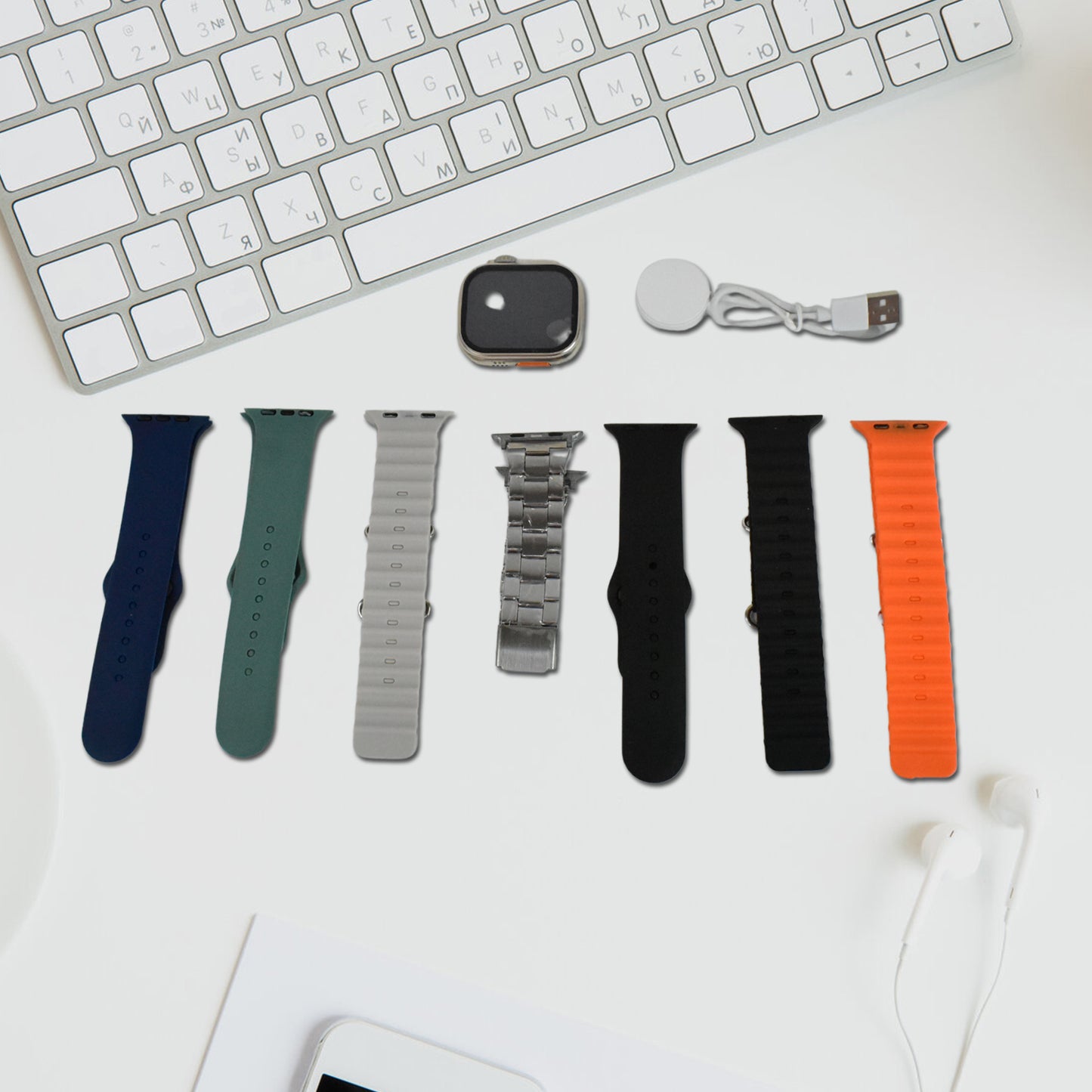 Wukusy 7-in-1 smart watch combo with seven classic straps and transparent screen guard, displayed in a mix of colors.