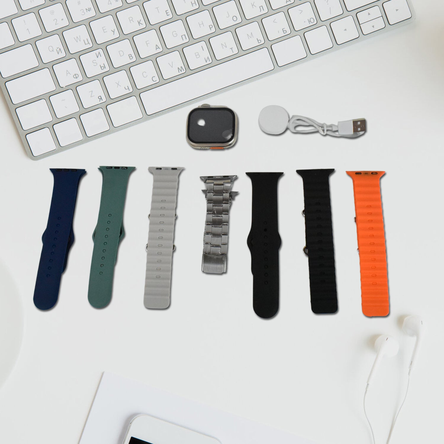 Wukusy 7-in-1 smart watch combo with seven classic straps and transparent screen guard, displayed in a mix of colors.