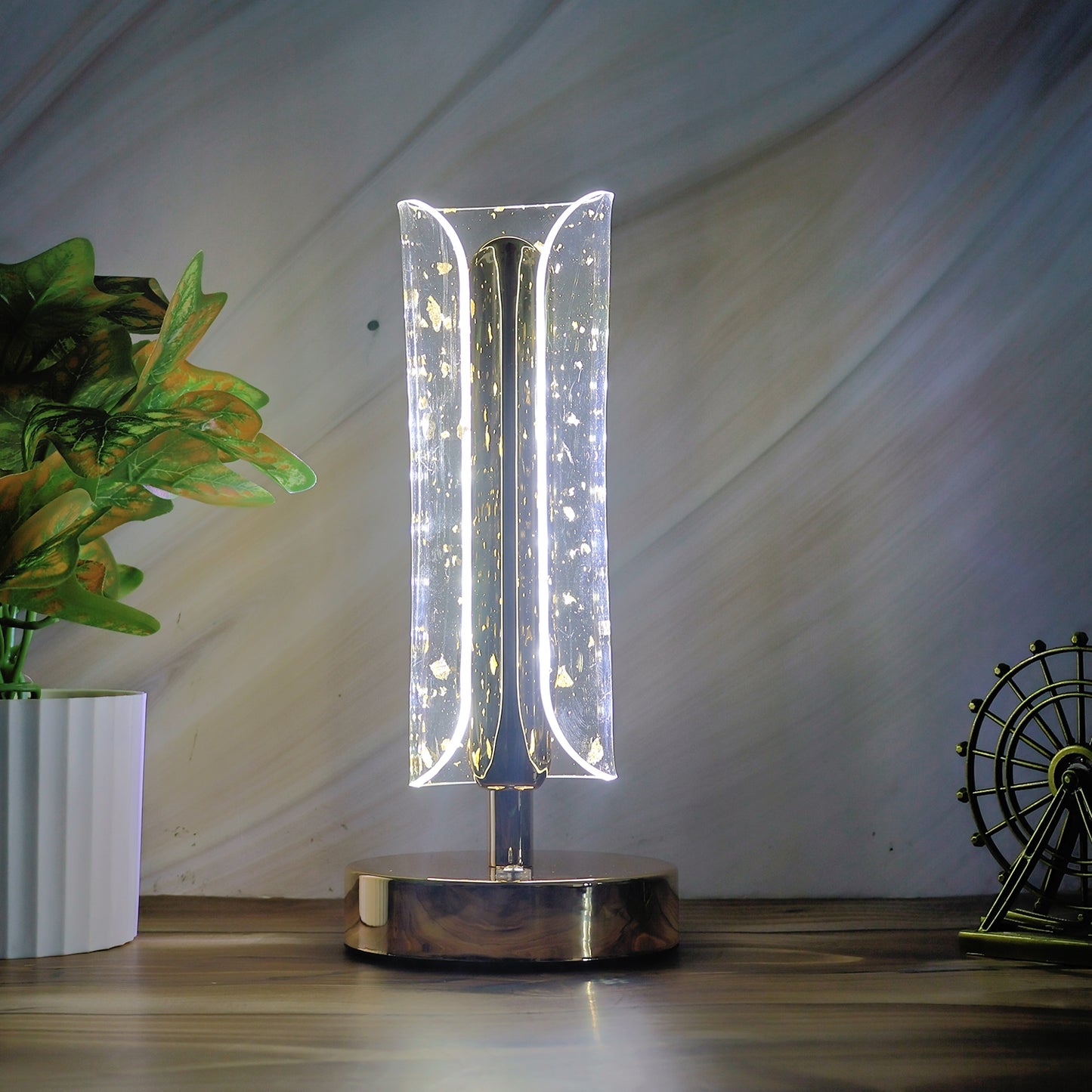 Wukusy crystal table lamp with a sleek base and intricate crystal detail, illuminated to showcase its elegant design.