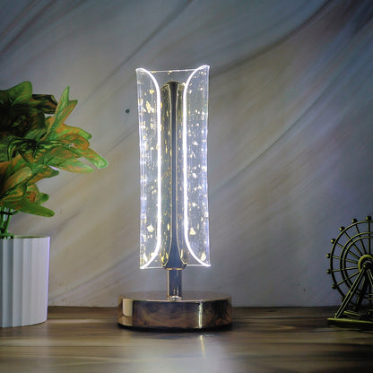 Wukusy crystal table lamp with a sleek base and intricate crystal detail, illuminated to showcase its elegant design.