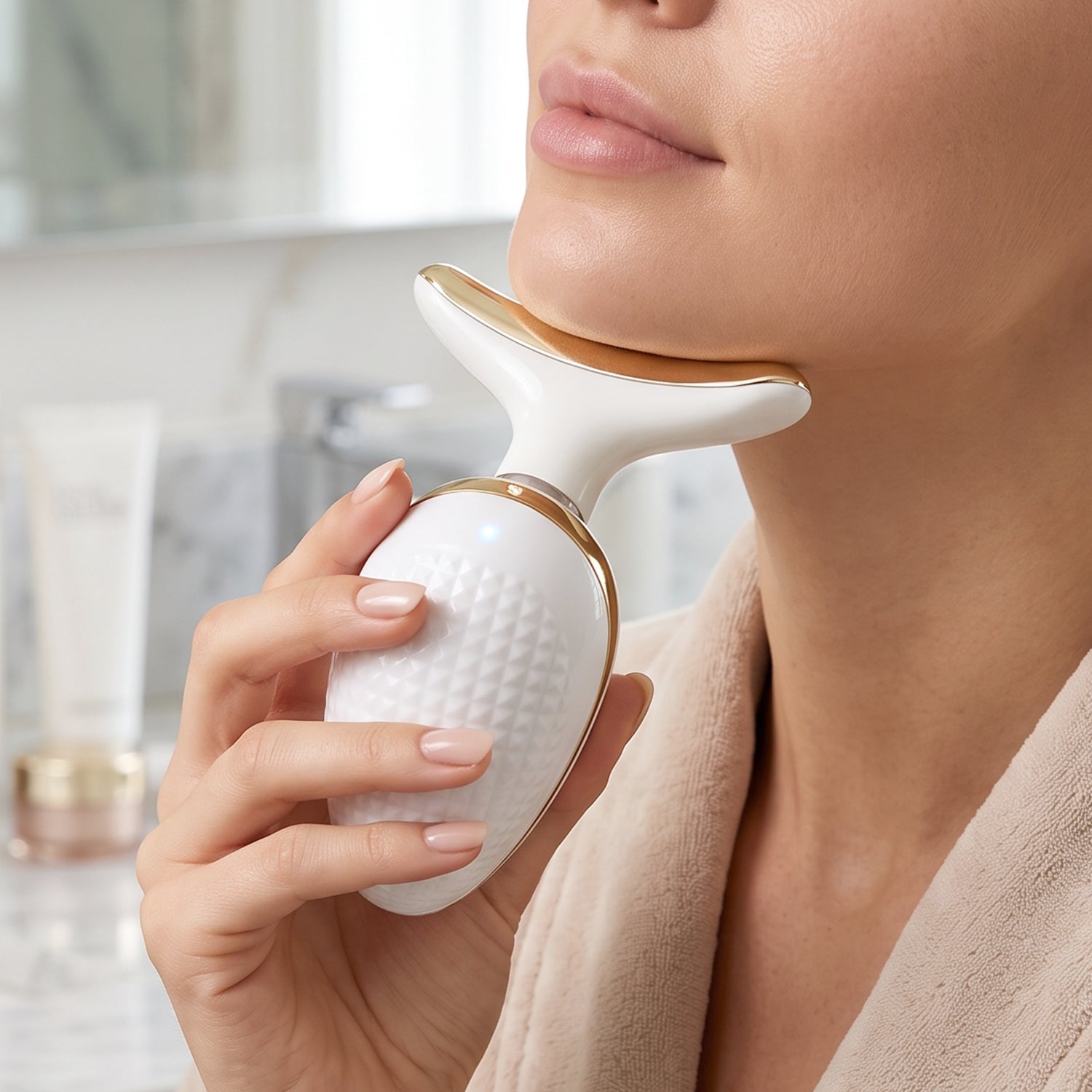 Wukusy electric neck and face massager lifting and firming skincare device resting on a white surface.