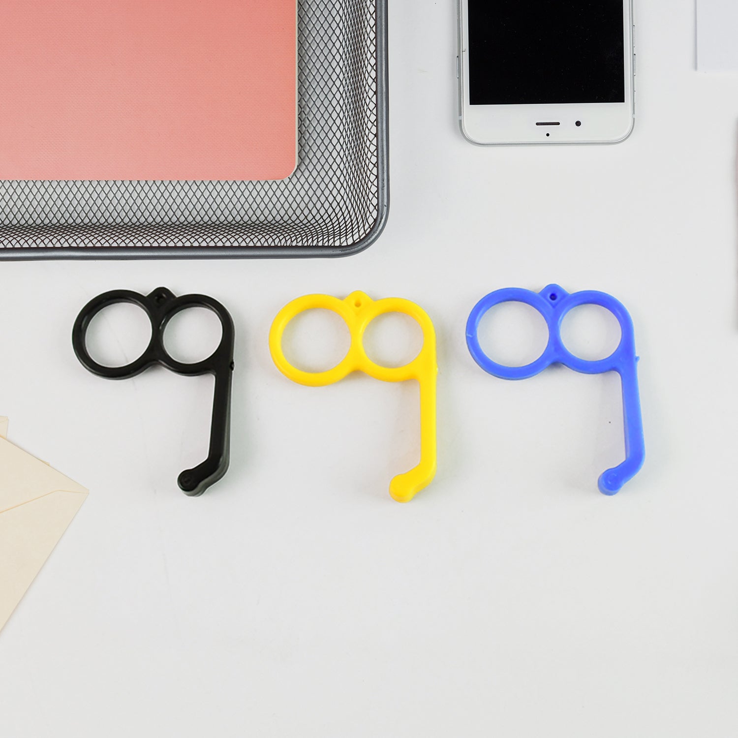 Colorful plastic hand mobile stand by Wukusy, showcasing a versatile mobile accessory for holding smartphones securely.
