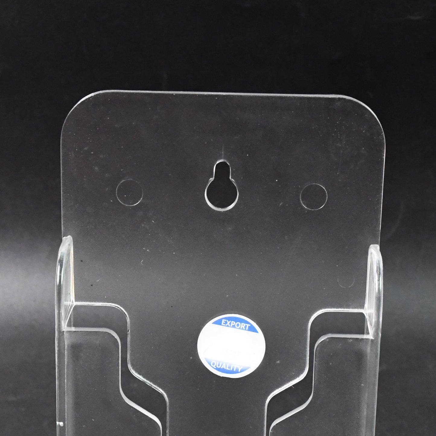 Wukusy wall mount mobile phone holder stand for home and office, securely holding a smartphone on a wall or desk surface.
