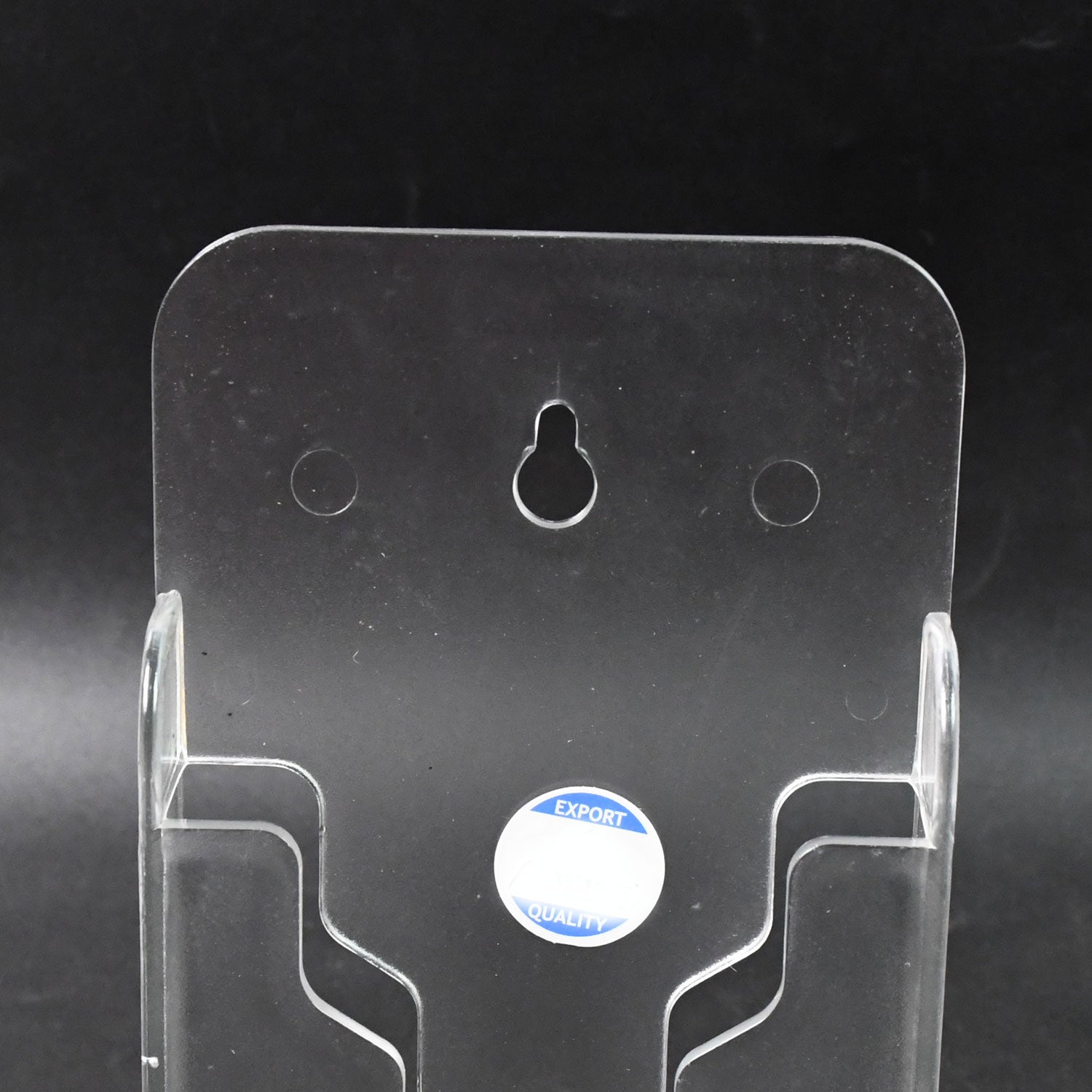Wukusy wall mount mobile phone holder stand for home and office, securely holding a smartphone on a wall or desk surface.