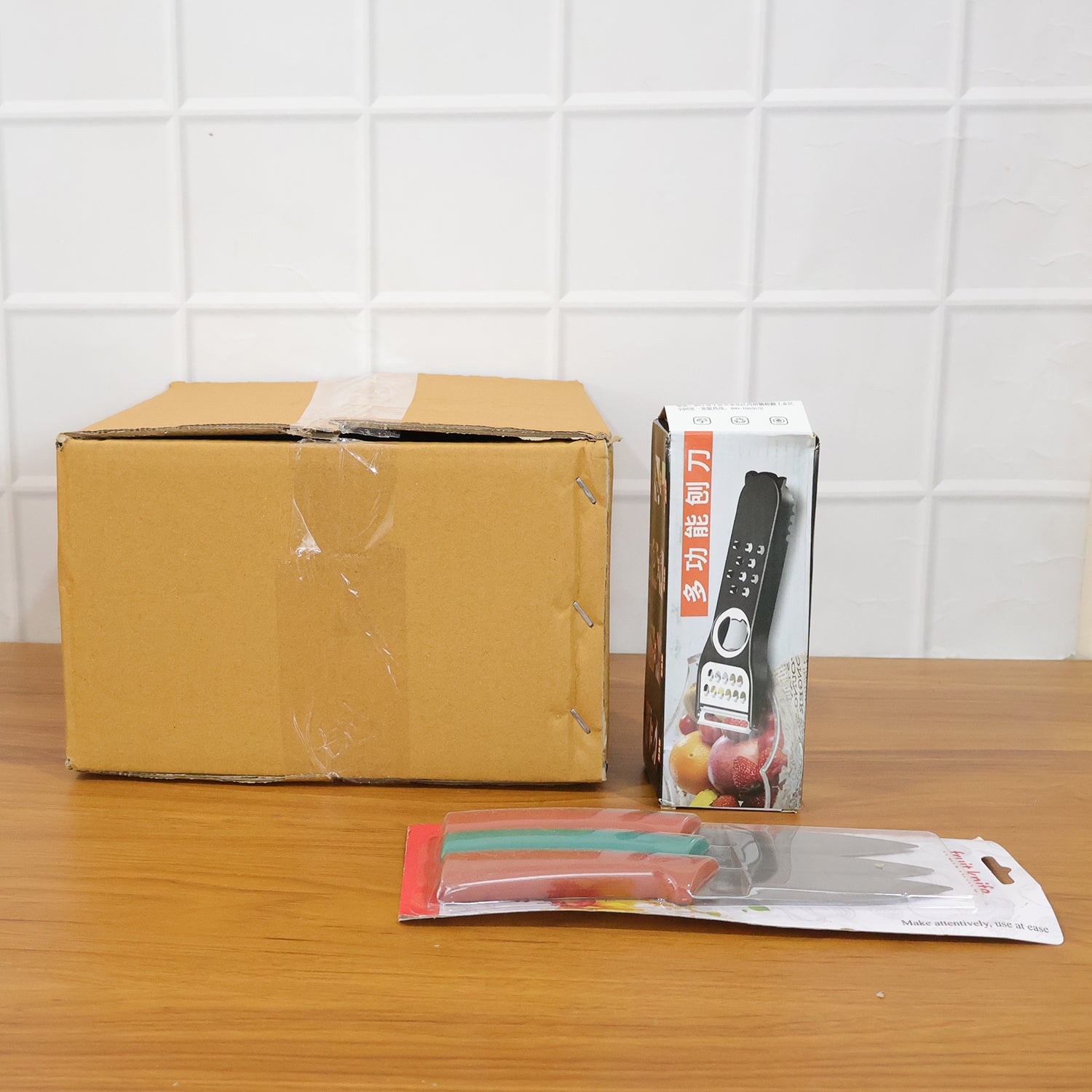 Wukusy 3-piece kitchen knife set with sharpener, including chef, utility, and paring knives on a wooden surface.