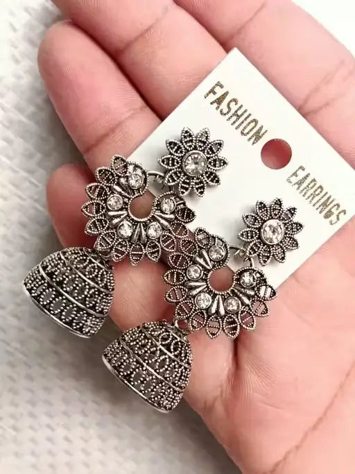 Set of four oxidized silver Jhumki and hoop earrings for women and girls, featuring traditional jewelry from Ekom.