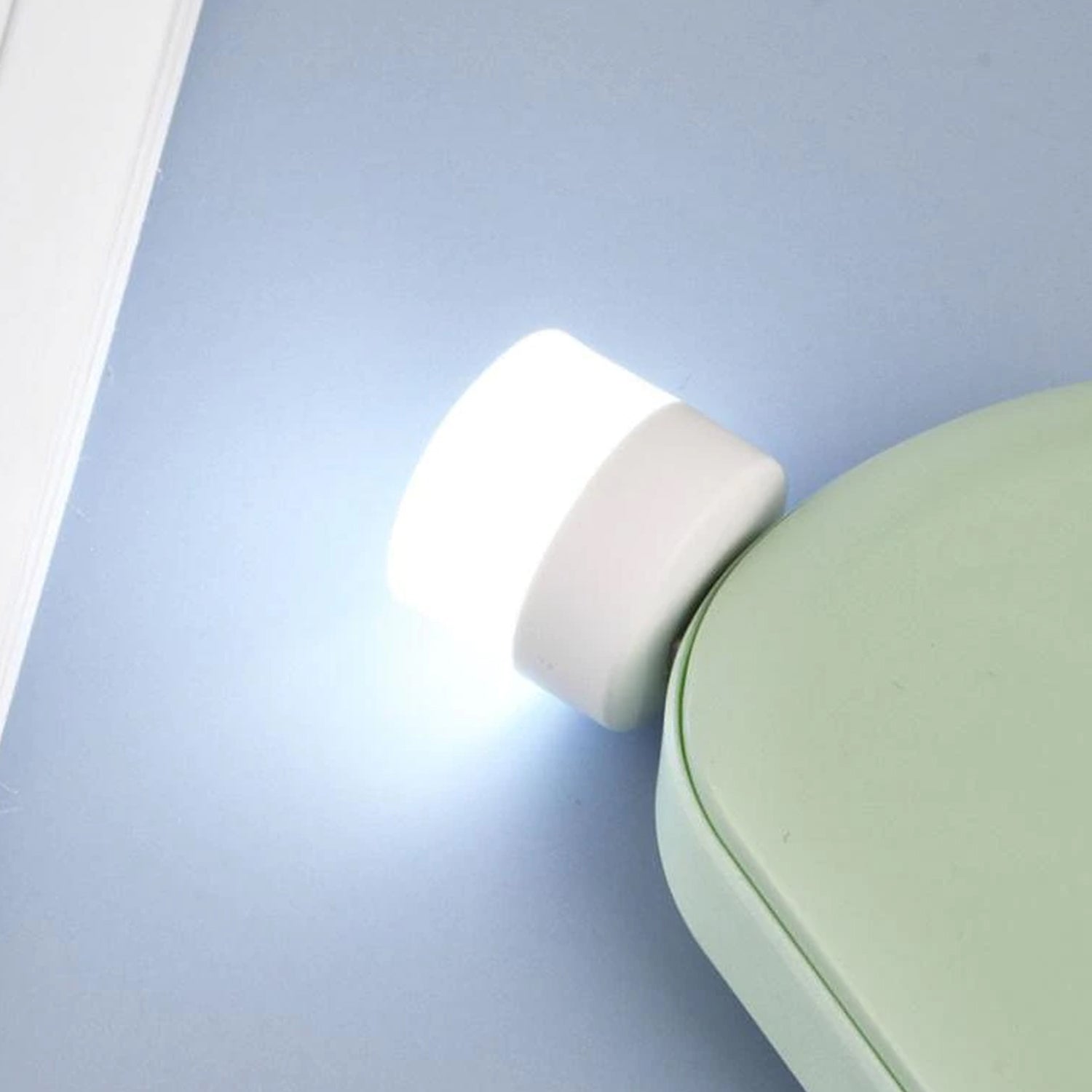 Wukusy USB LED night light plugged into a laptop, compact portable mini LED nightlight for PC and laptop use.