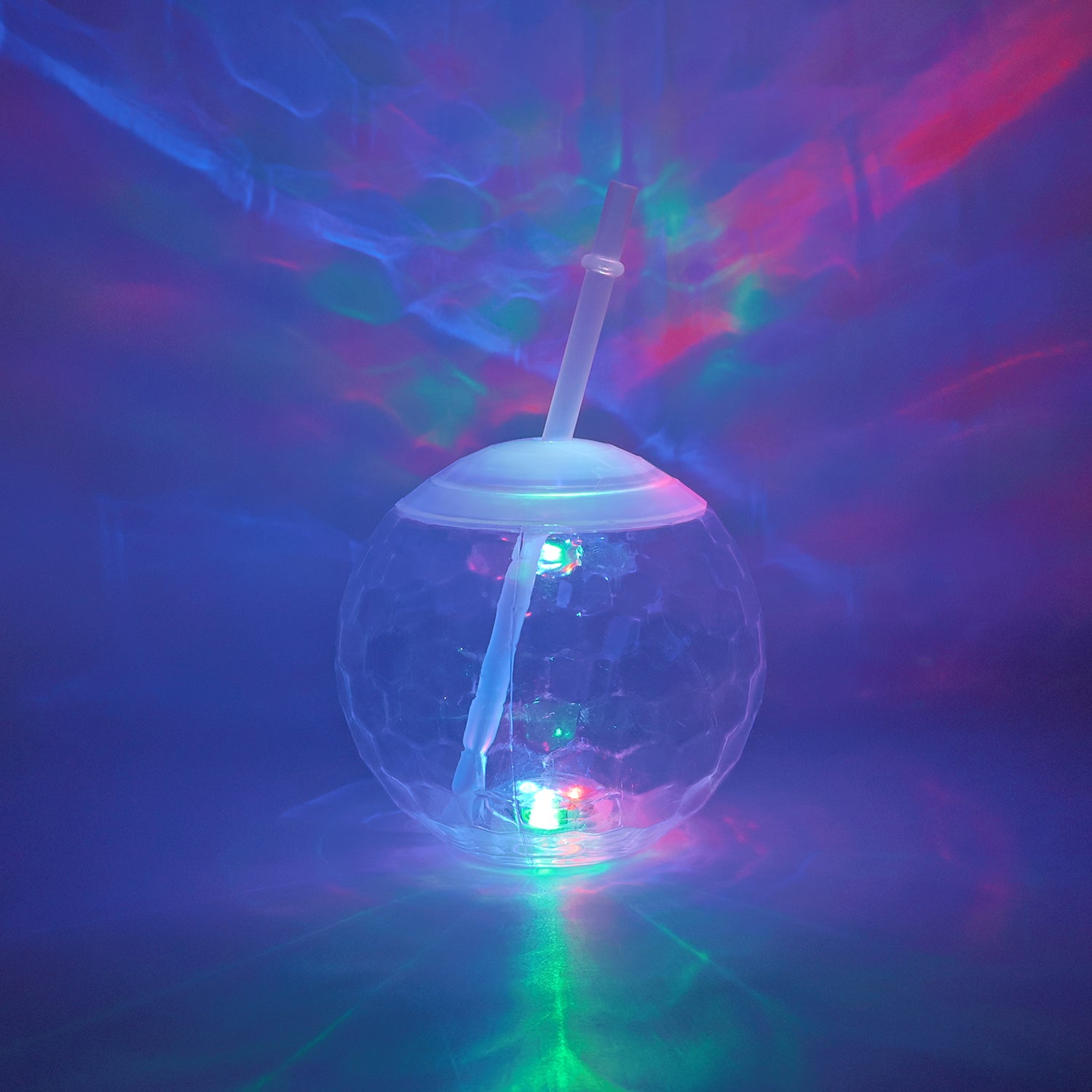 Wukusy LED glow drink cup with straw, illuminated in vibrant colors, perfect for parties and nighttime celebrations.