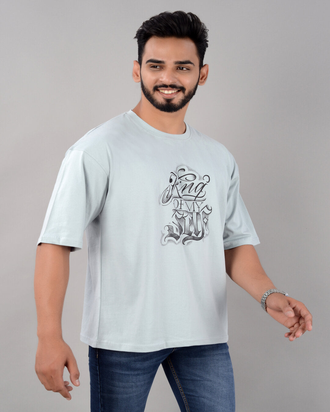 Men's turquoise cotton blend oversized graphic T-shirt with drop shoulder, round neck, and half sleeves from Drpshippr.