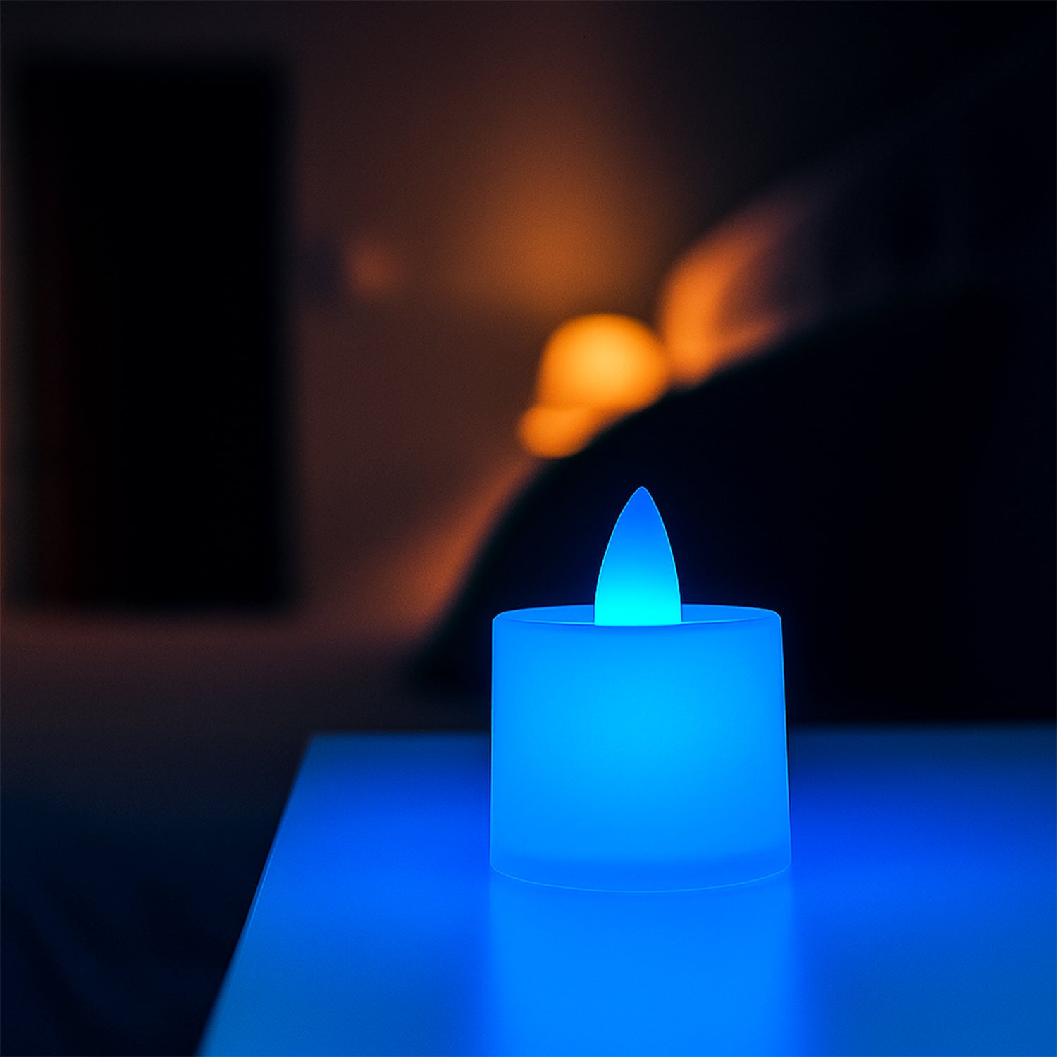 Set of 24 blue LED tea light candles by Wukusy, flickering battery-operated candles for ambiance and decoration.