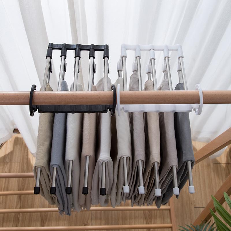 Wukusy 4660 adjustable trouser pants hanger organizer holding multiple pairs of pants in a closet.