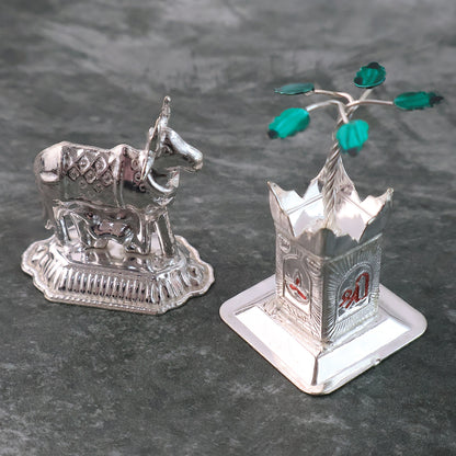 Silver-plated Kamdhenu Cow and Tulsi plant pair for pooja and home decor by Wukusy, featuring detailed craftsmanship and elegant design.
