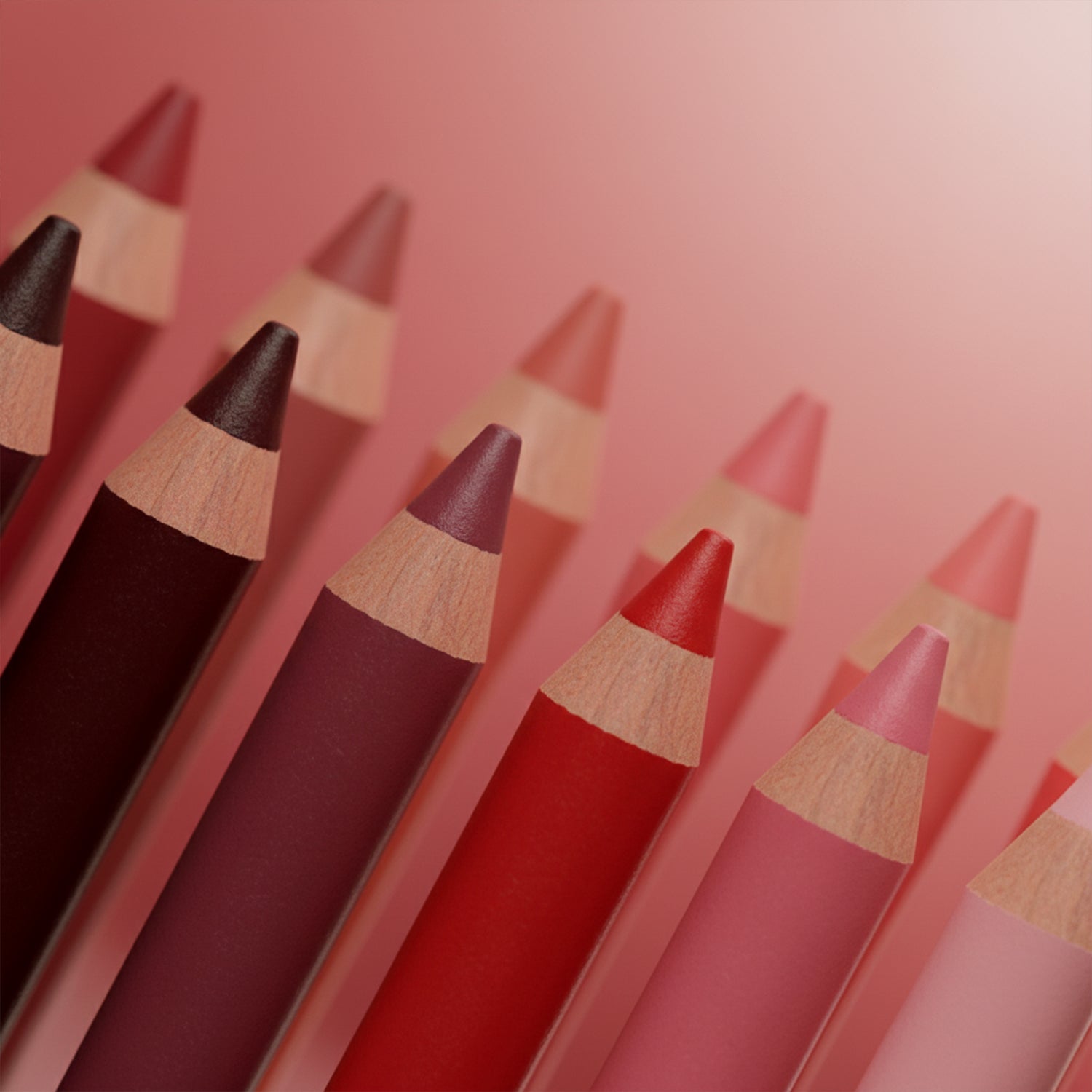 Set of 12 Wukusy matte lipstick pencils with colorful caps, arranged in a row displaying various shades and textures.