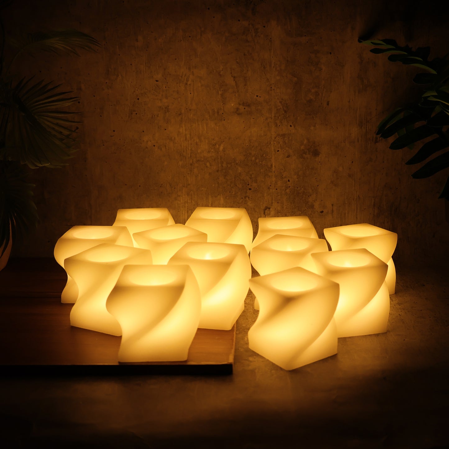 Set of 12 Wukusy LED flameless square decorative candles with tealight lamps for home decor, showing soft glowing light and modern design.