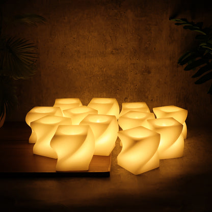 Set of 12 Wukusy LED flameless square decorative candles with tealight lamps for home decor, showing soft glowing light and modern design.