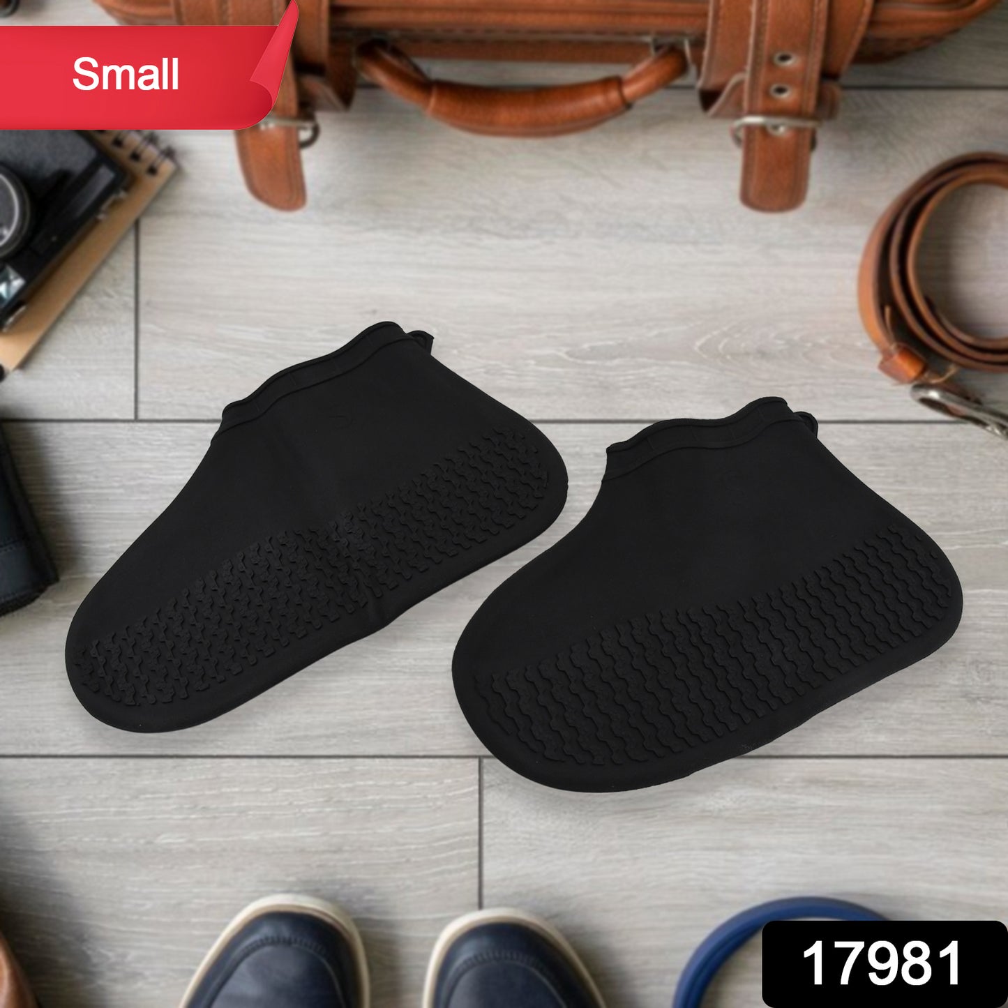 Pair of Wukusy non-slip silicone rain boot covers in small size, waterproof and foldable for protection against wet conditions.