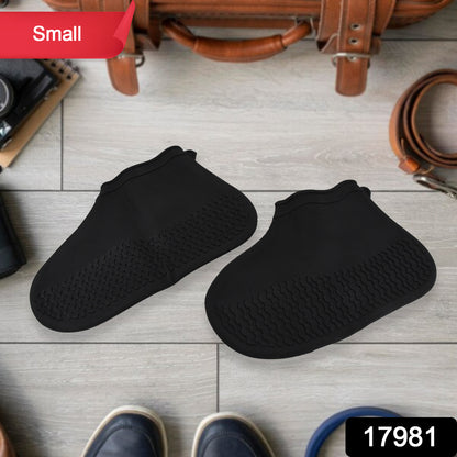 Pair of Wukusy non-slip silicone rain boot covers in small size, waterproof and foldable for protection against wet conditions.
