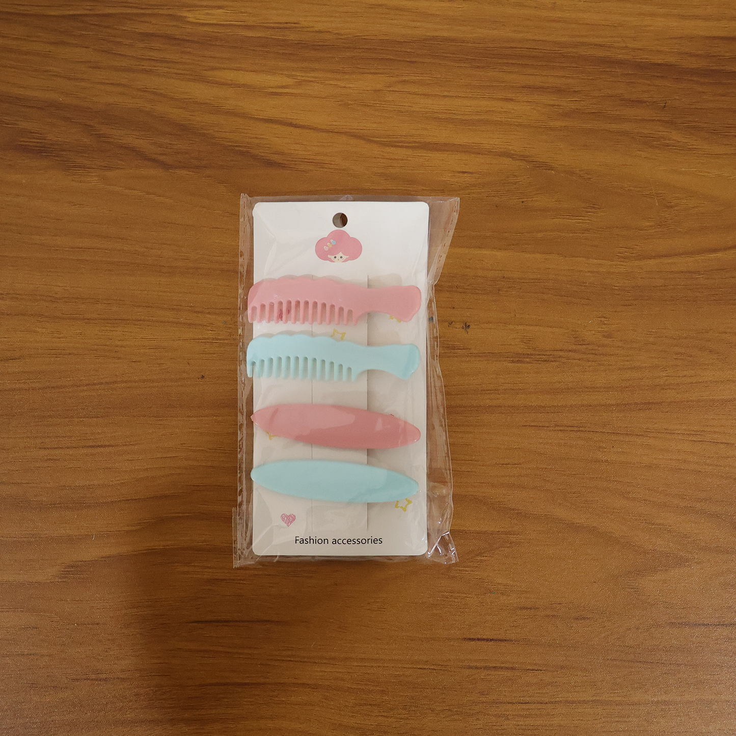 Set of four pastel-colored comb-style hair clips by Wukusy, featuring smooth, curved design for easy hair styling.