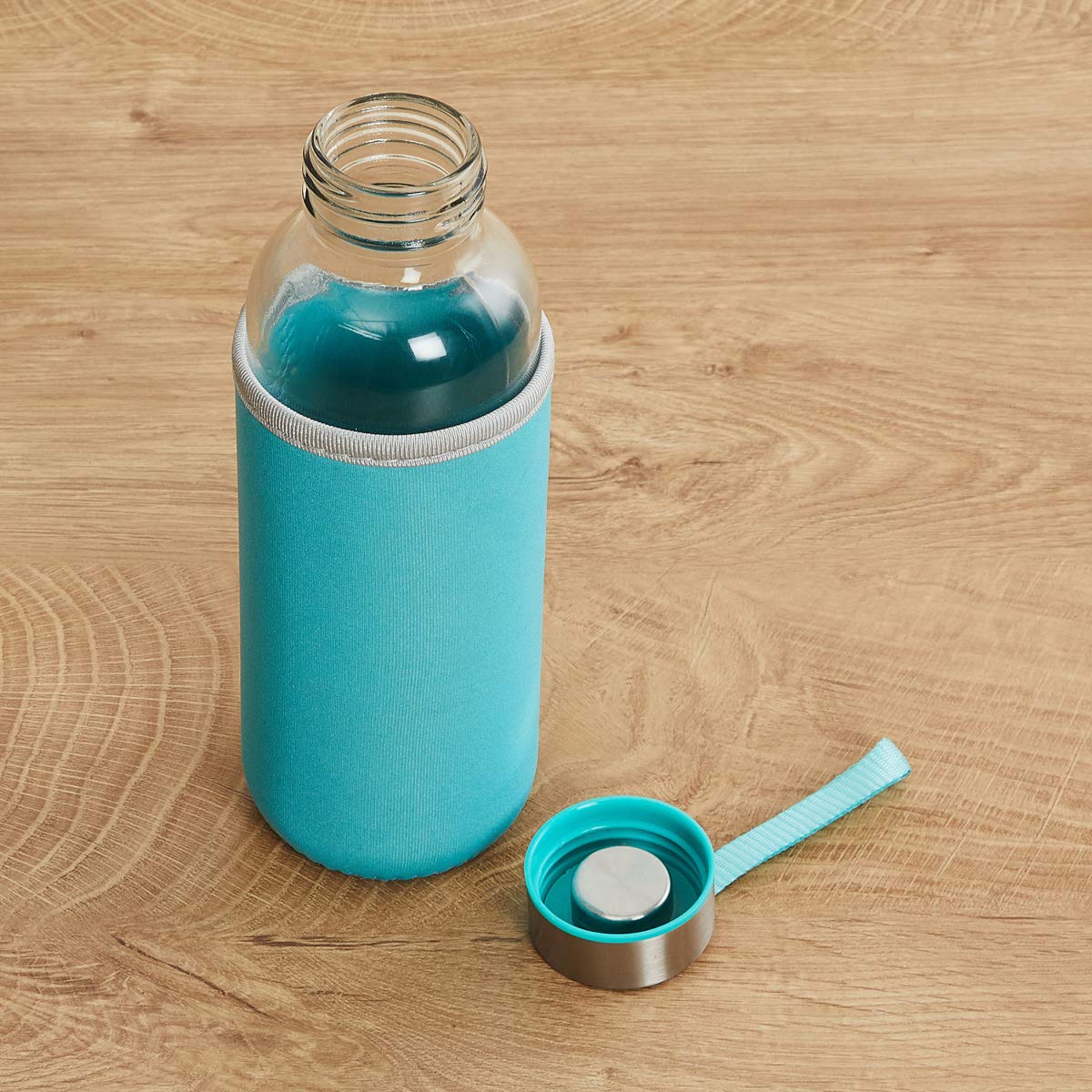 Wukusy 1199 glass water bottle with 500ml capacity and cover, clear design, suitable for hydration on the go