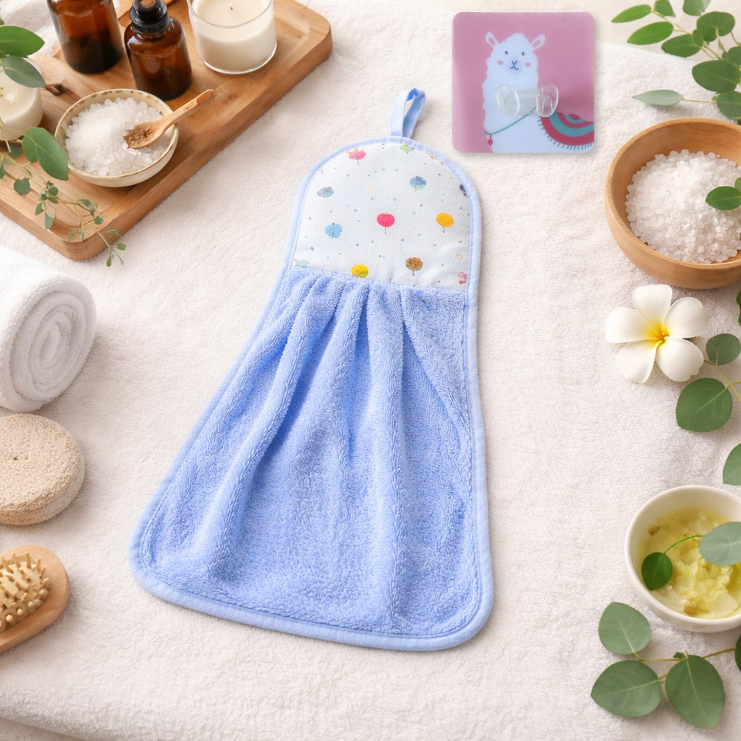 Soft hanging hand towel with self-adhesive wall hook from Wukusy, displayed hanging on the hook in a bathroom setting.