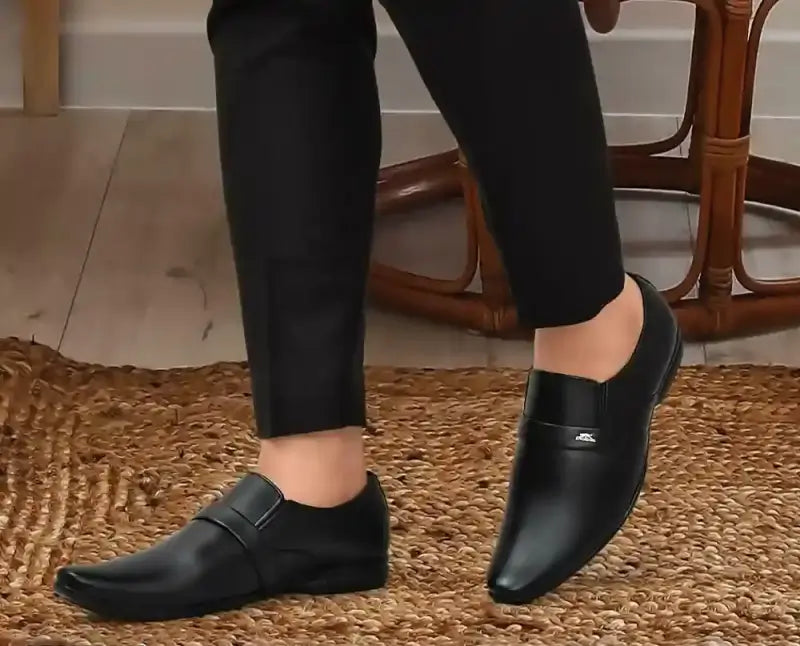 Black men's formal moccasin shoes from Ekom, stylish office footwear suitable for boys and men, featuring a sleek design.