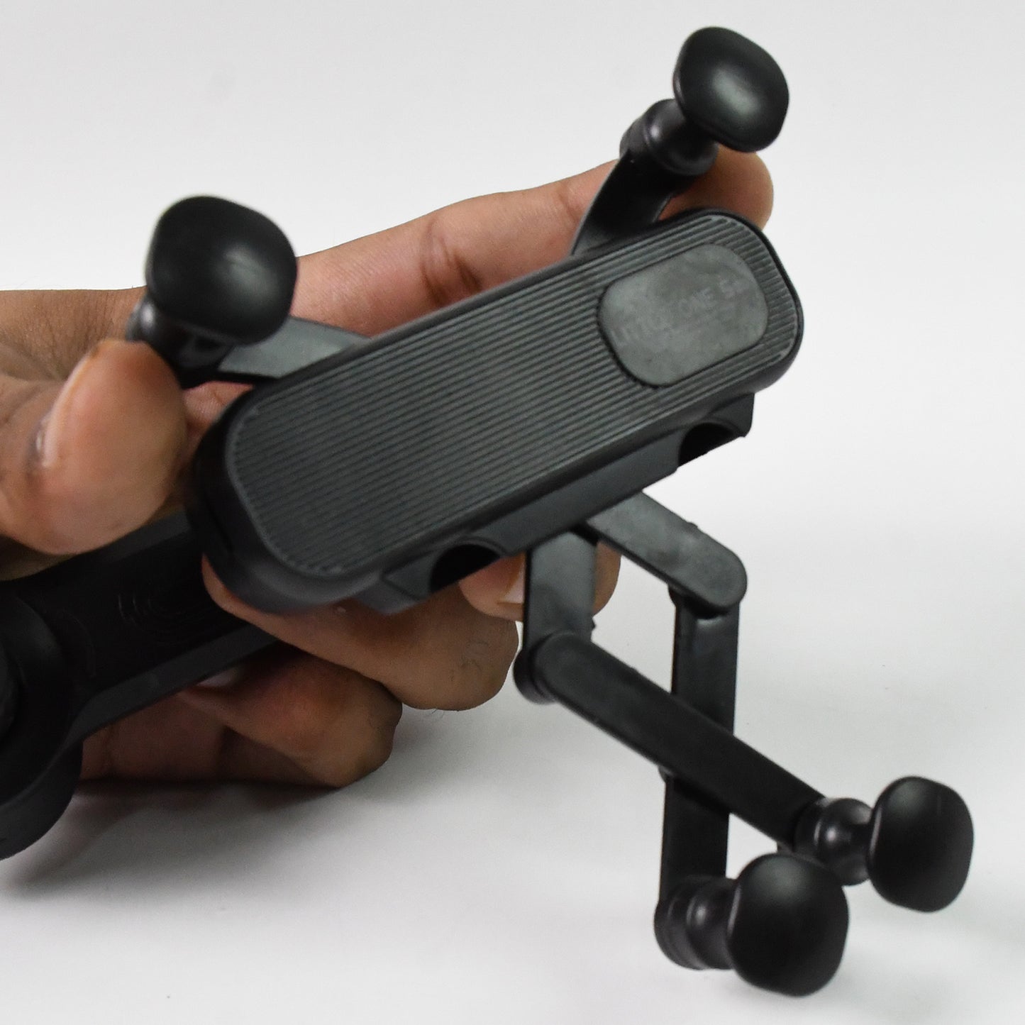 Wukusy 360-degree car mobile phone holder mounted in a vehicle dashboard, adjustable for secure smartphone display.