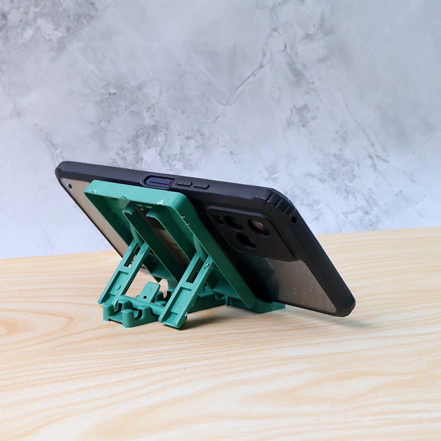 Wukusy 610 adjustable 4-step foldable mobile stand holder for smartphones, showing its compact, portable design and adjustable angles.