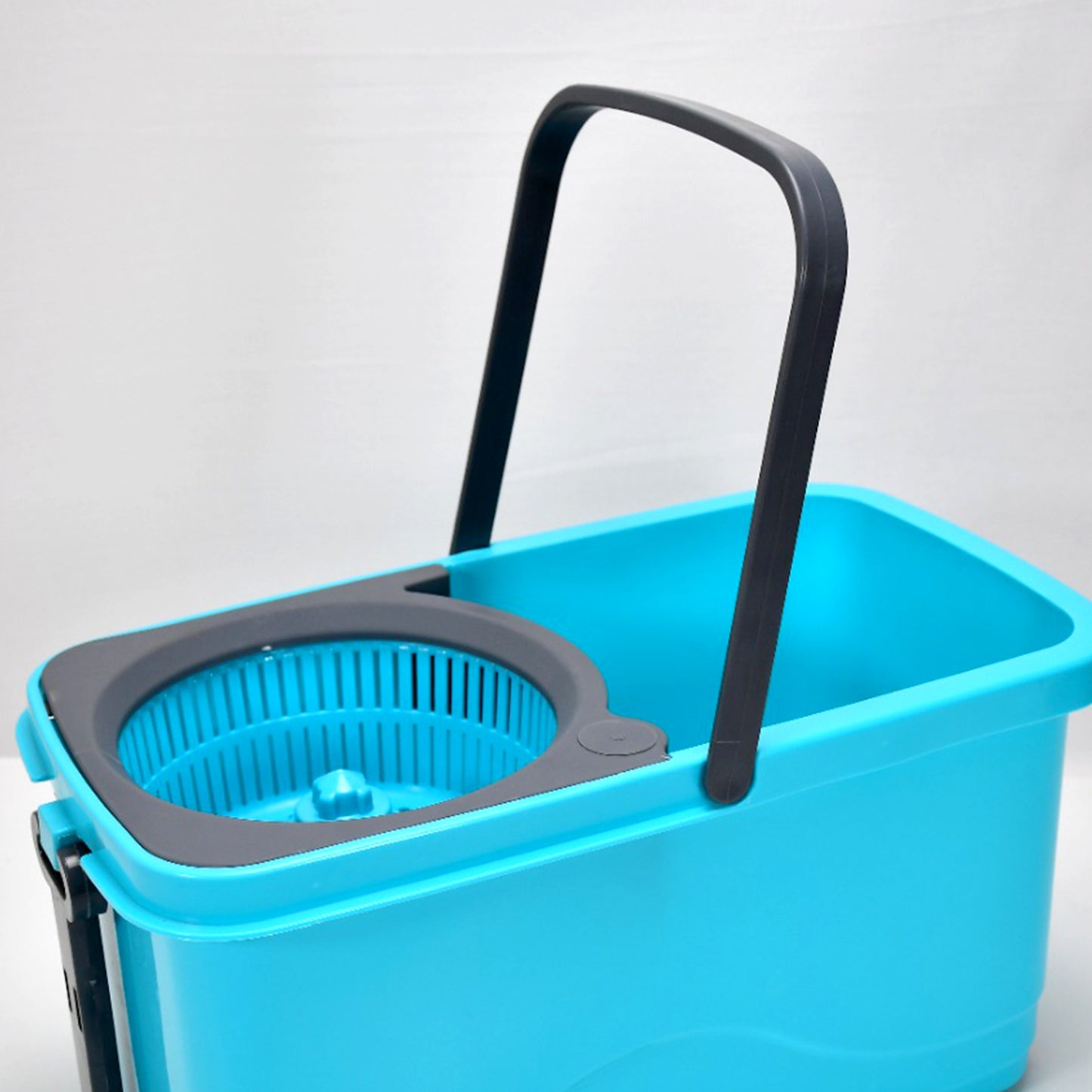 Wukusy Quick Spin Mop with plastic spin bucket, easy wheels, and large capacity for efficient floor cleaning.