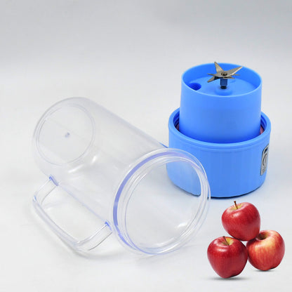 Portable electric juicer with handle, stainless steel blades, USB rechargeable, 500ml capacity, in a sleek home kitchen design.