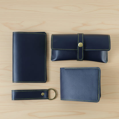 Wukusy 4-in-1 men's premium PU leather wallet gift set with four different wallets in black and brown leather, displayed on a neutral background.