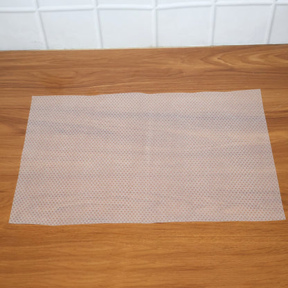 Clear plastic fridge mat from Wukusy, measuring 45x29 cm, designed to protect fridge shelves from spills and stains.