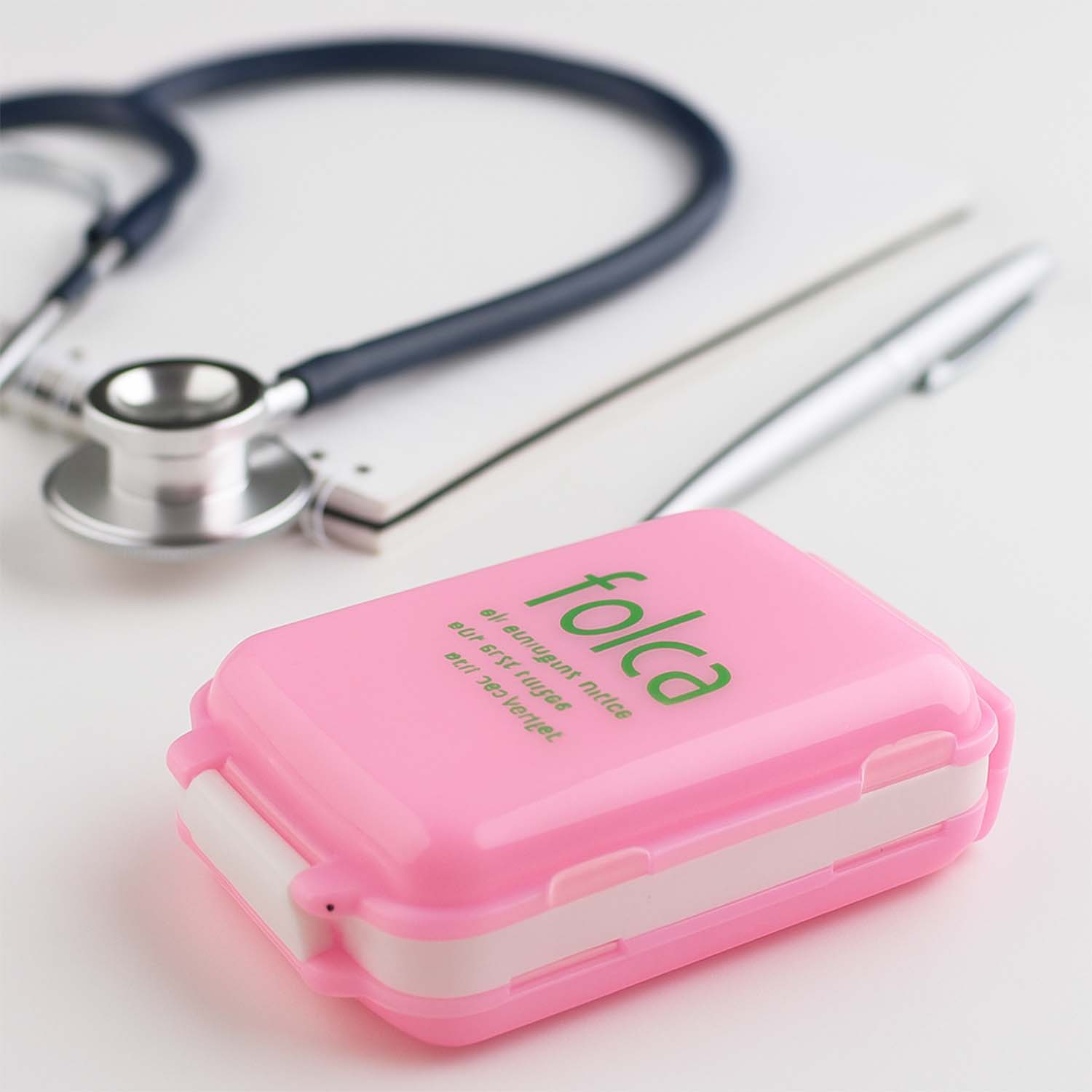 Pink dual-sided Wukusy portable pill organizer box with compartments for medication storage, ideal for travel and daily use.