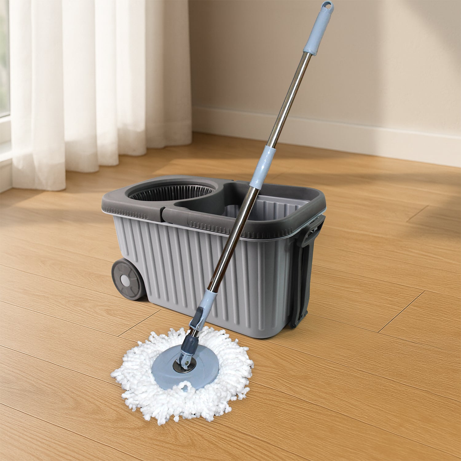 Wukusy Apex Magic Spin Mop cleaning set with dual chamber bucket and wheels, featuring a microfiber mop head and ergonomic handle.