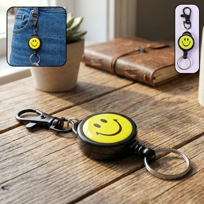 Wukusy smiley face retractable keychain with bright yellow design and metal clip, ideal for holding keys or small accessories.