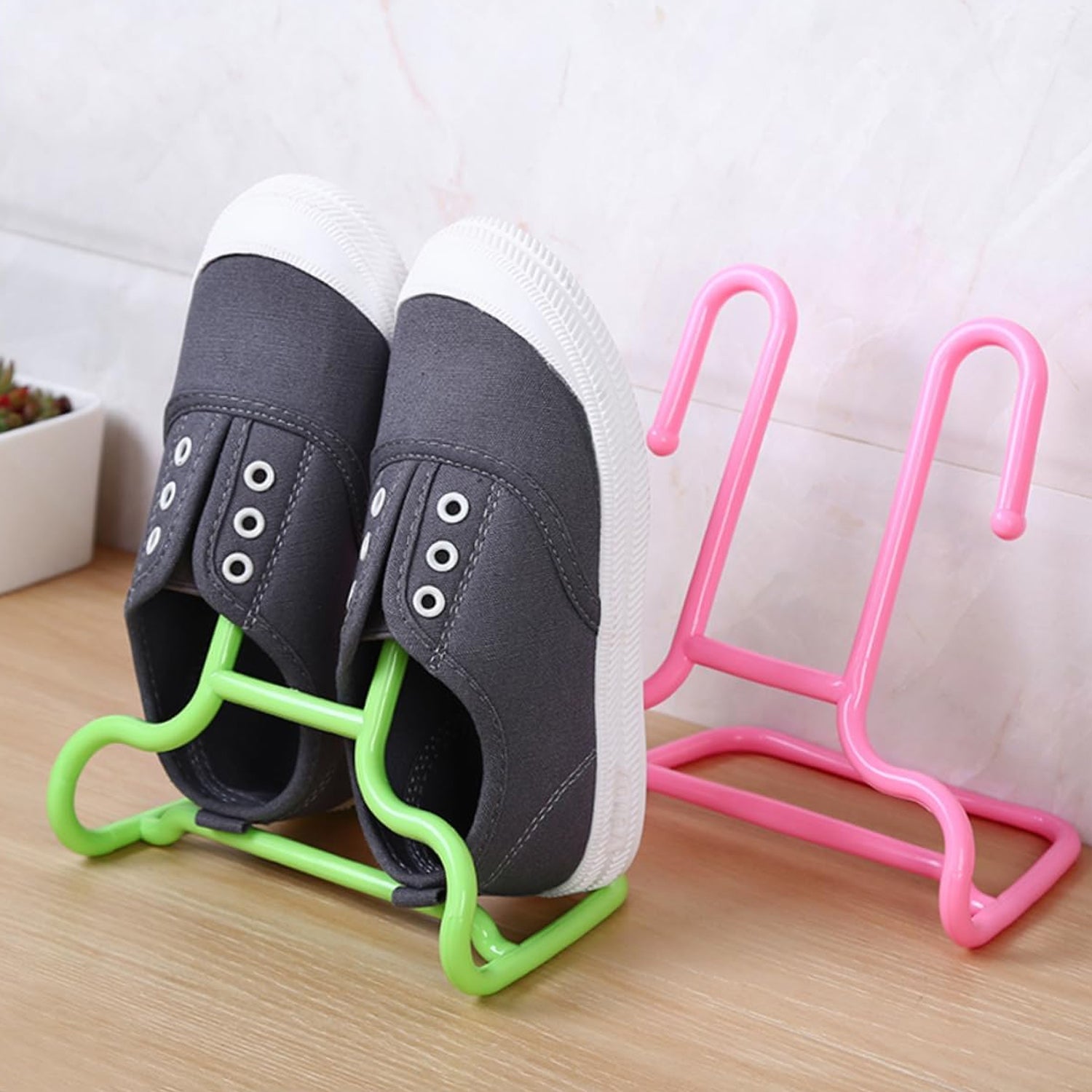 Wukusy 2-pack multi-function shoe and hanger rack with shelves for shoe storage, drying, and wardrobe organization in a home closet.