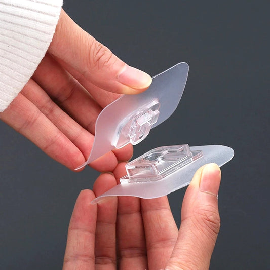 Pair of Wukusy adhesive plastic wall hooks, heavy-duty hooks for hanging accessories or lightweight items on walls.