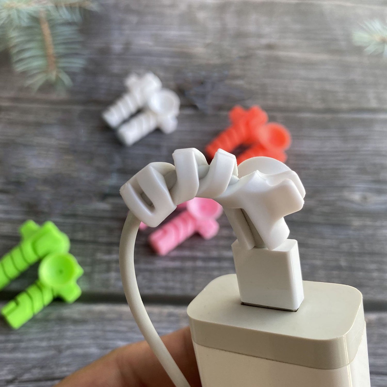 Set of four Wukusy cable cord protectors with suction ends, designed to prevent cable damage and keep cords organized.