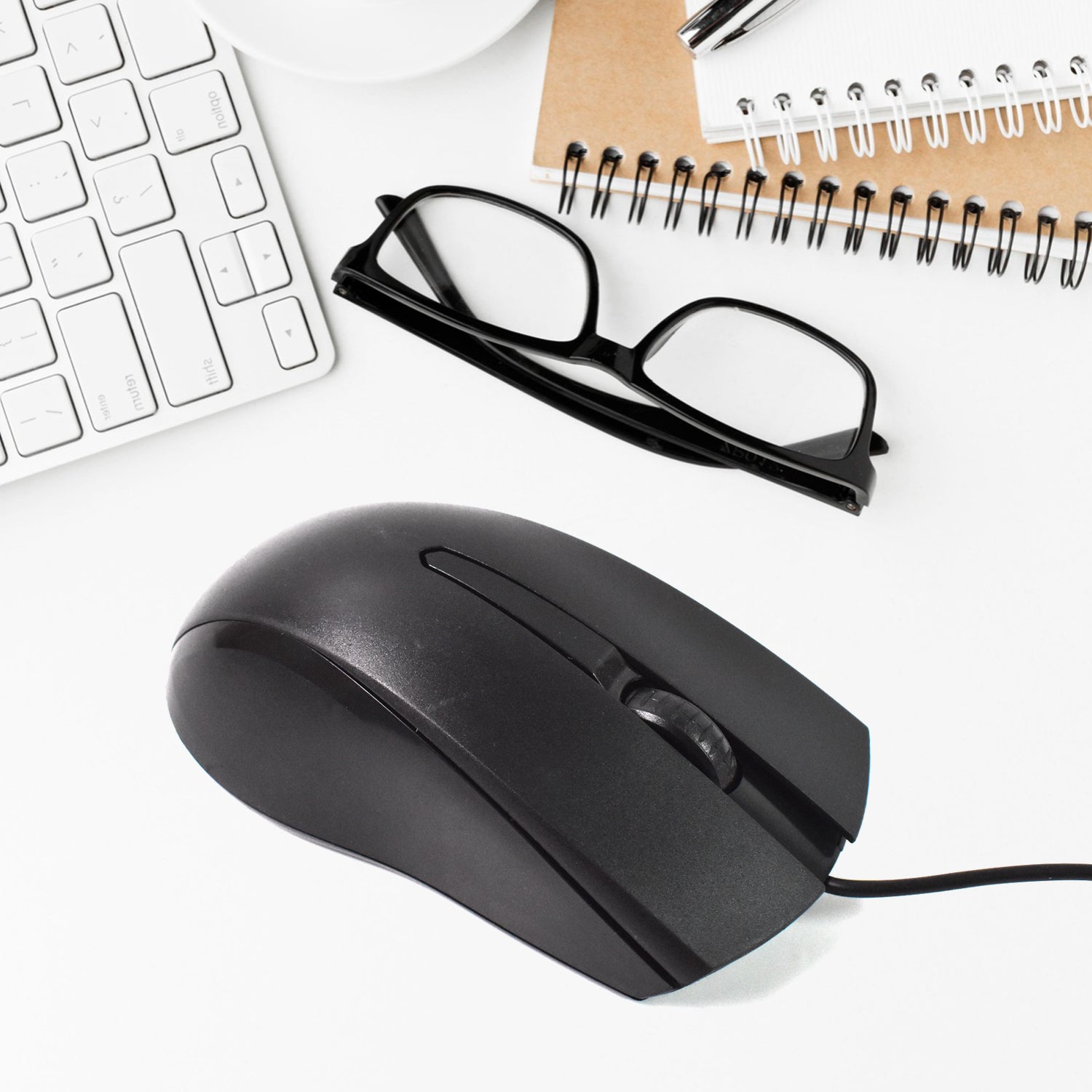 Wukusy wired optical mouse for computers and laptops, black, with ergonomic design and USB connection, shown on a desk.