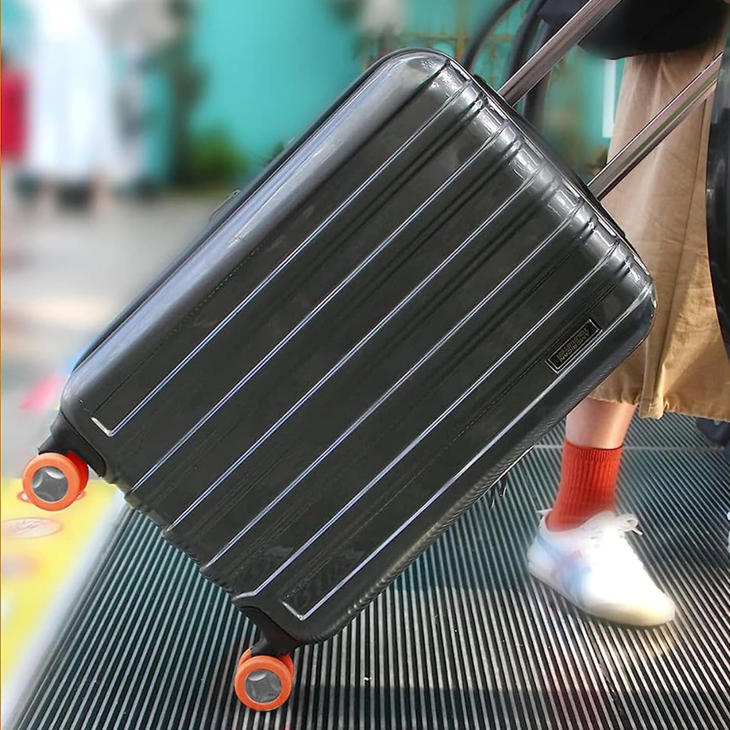 Wukusy luggage wheel covers set of 8 silicone protectors for suitcases, reducing noise and protecting wheels during travel.