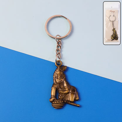 Antique-gold metal Bal Krishna Makhan Chor keychain accessory with detailed Krishna figure, ideal for key or bag decoration.