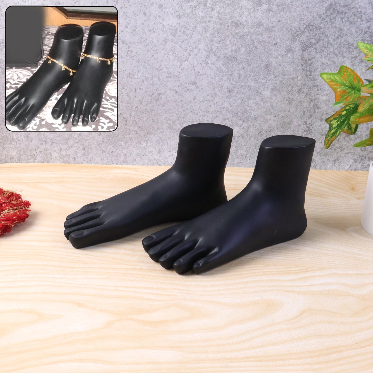 Pair of black foot mannequin display stands by Wukusy, used as accessories for showcasing footwear or fashion items.
