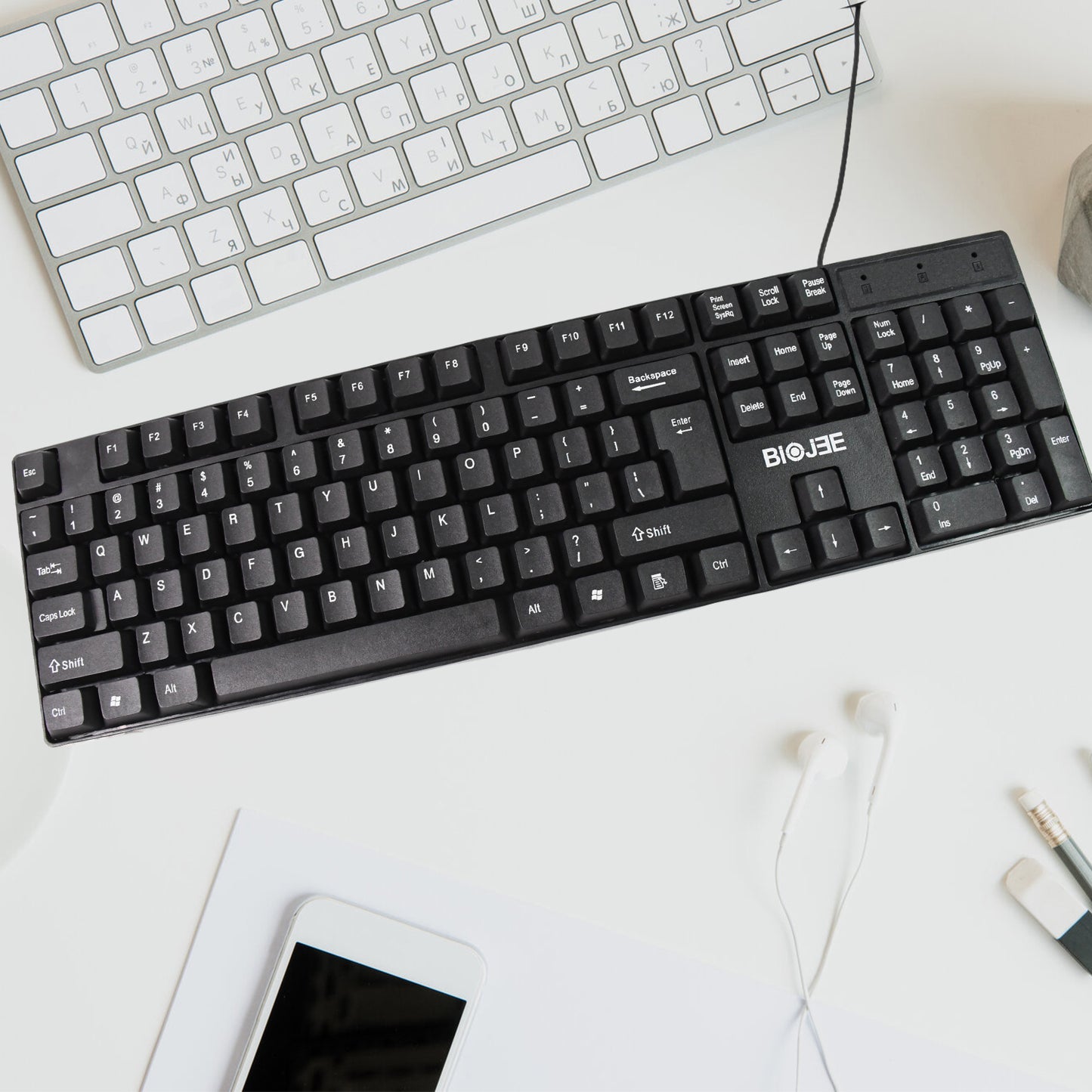 Wukusy wired USB keyboard with 104 keys, standard layout, black design, showing keycaps and connection cable.