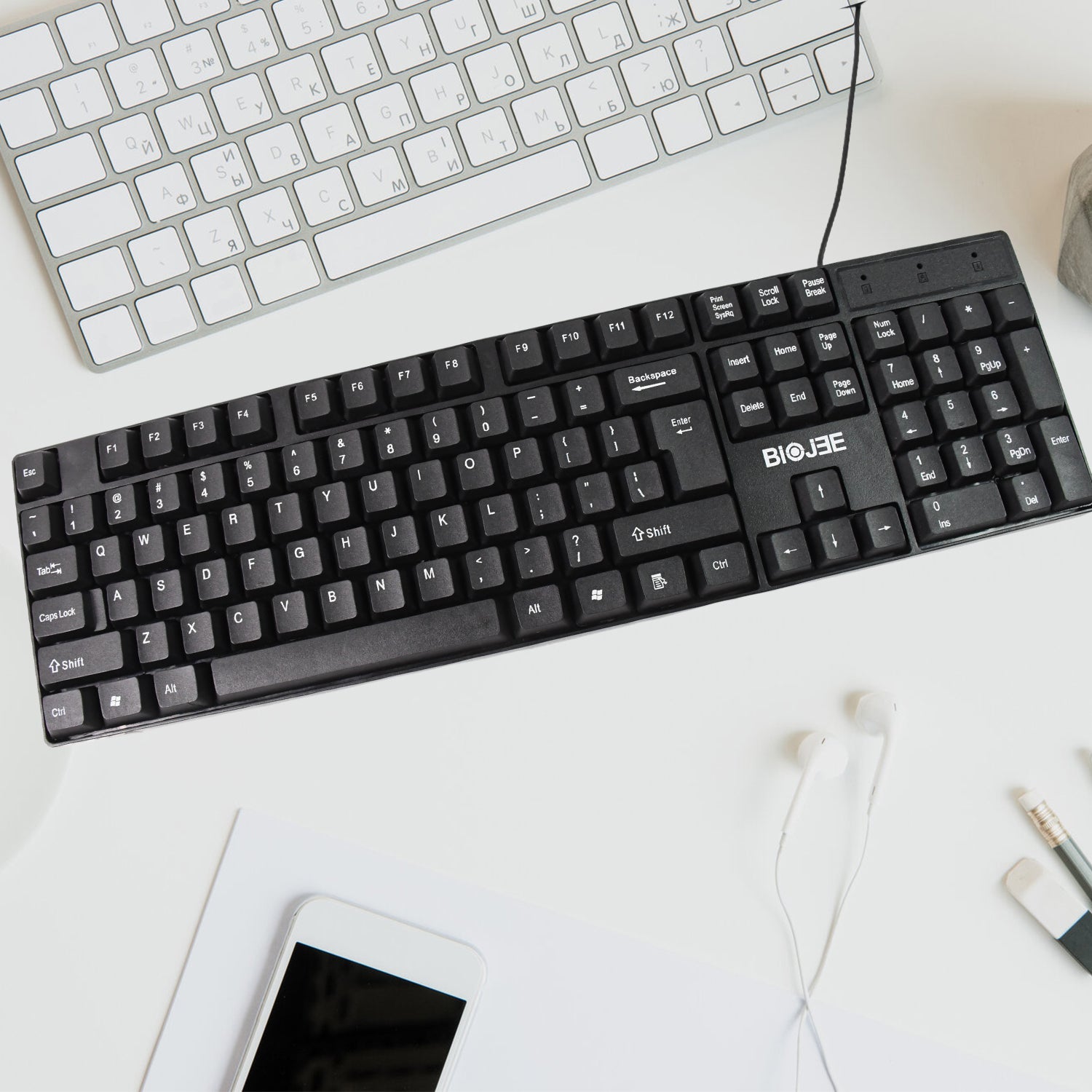 Wukusy wired USB keyboard with 104 keys, standard layout, black design, showing keycaps and connection cable.