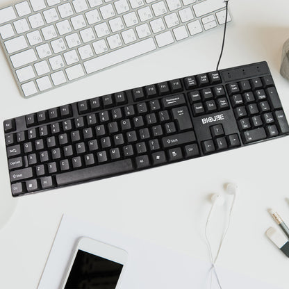 Wukusy wired USB keyboard with 104 keys, standard layout, black design, showing keycaps and connection cable.