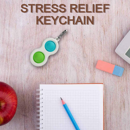 Wukusy Simple Dimple Fidget Toy Mini Keychain attached to a car key, automotive-themed small sensory stress relief toy.