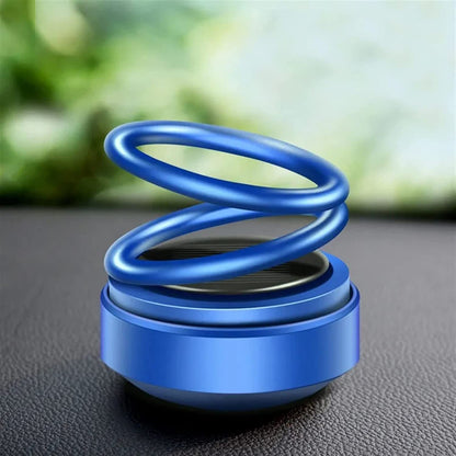Wukusy Solar Power Car Aroma Diffuser with 360° double-ring rotating design, car fragrance air freshener for dashboard and home.